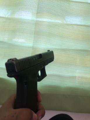 glock 17 being held side view